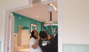 Person Being Hoisted Through A Doorway