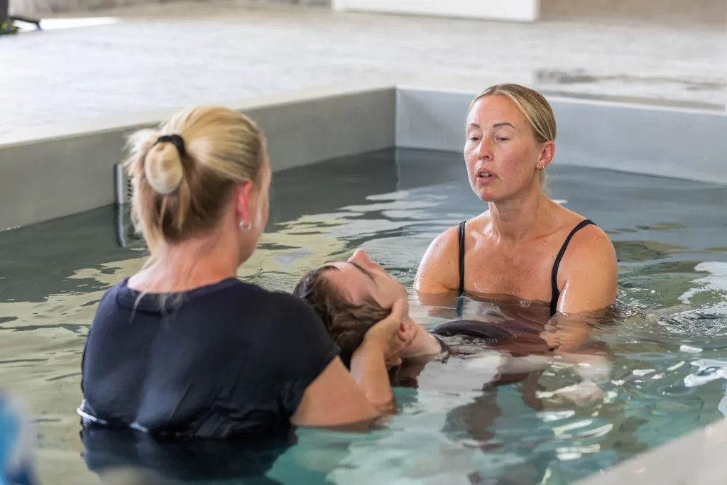 Quadriplegic cerebral palsy Client in Hydrotherapy Pool With Physio